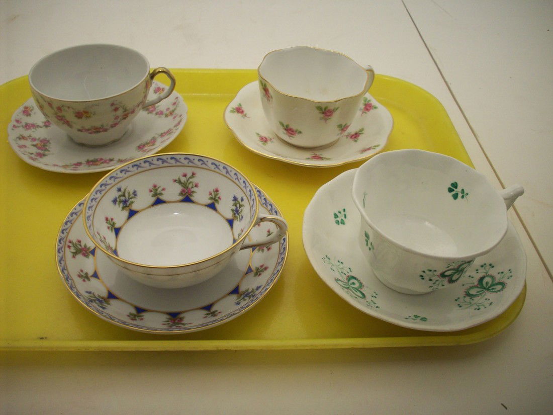 Tray Lot #2 Four Sets of Tea Cup and Saucer: Taylor & Kent bone china, roses, gold scalloped edges. Victoria red and yellow flowers, gold trim. Bernardaud Limoges, 'Chateaubriand' pattern with gold trim and decorated on inside of the cup. Unmark
