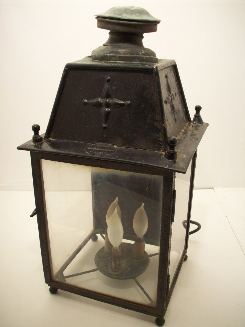 French Victorian Iron Hanging Lantern: 23" X 11 1/4" X 10 3/4", Turn of the century lantern with manufactures metal label: P.L.M. Leon Luchaire & Cie Paris, black painted iron frame around 3 glass panels. Front is a hinged door, with latch
