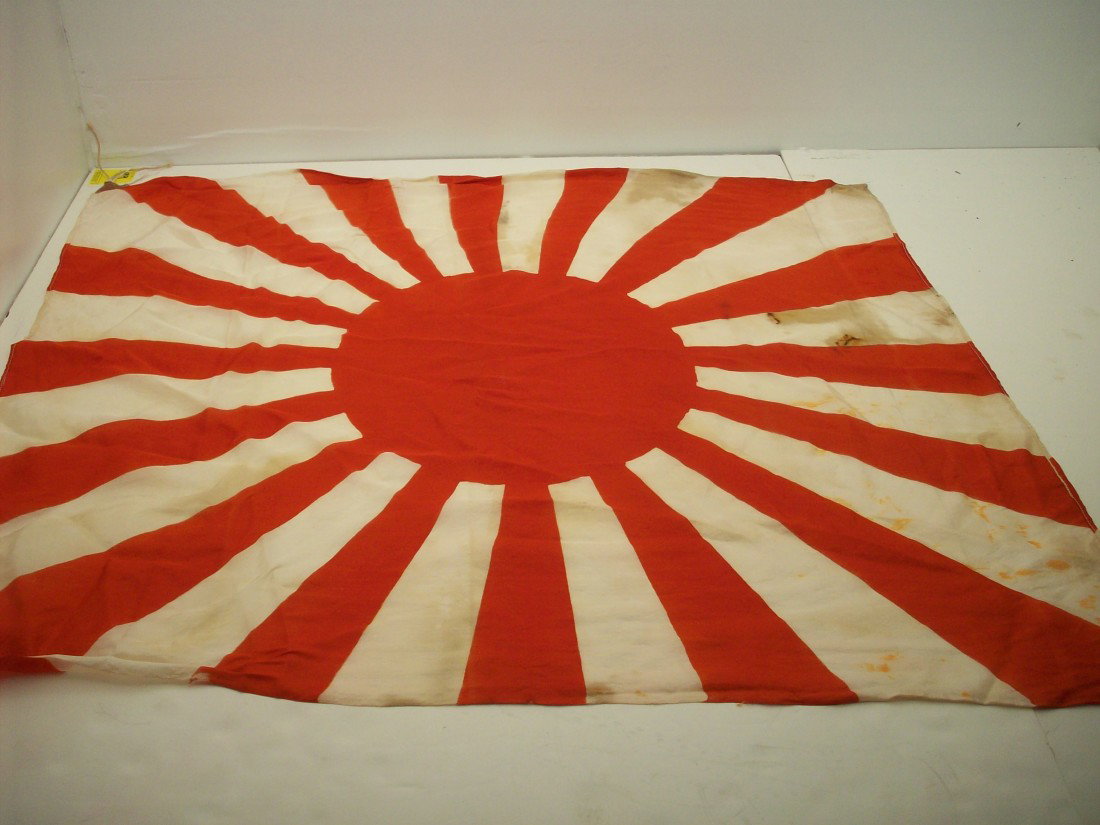 WWII Japanese Army Rising Sun Flag: 35" X 30", Silk flag with heavy cloth corners with tying strings. WWII flag shows age with staining and few tiny holes. Great military flag.