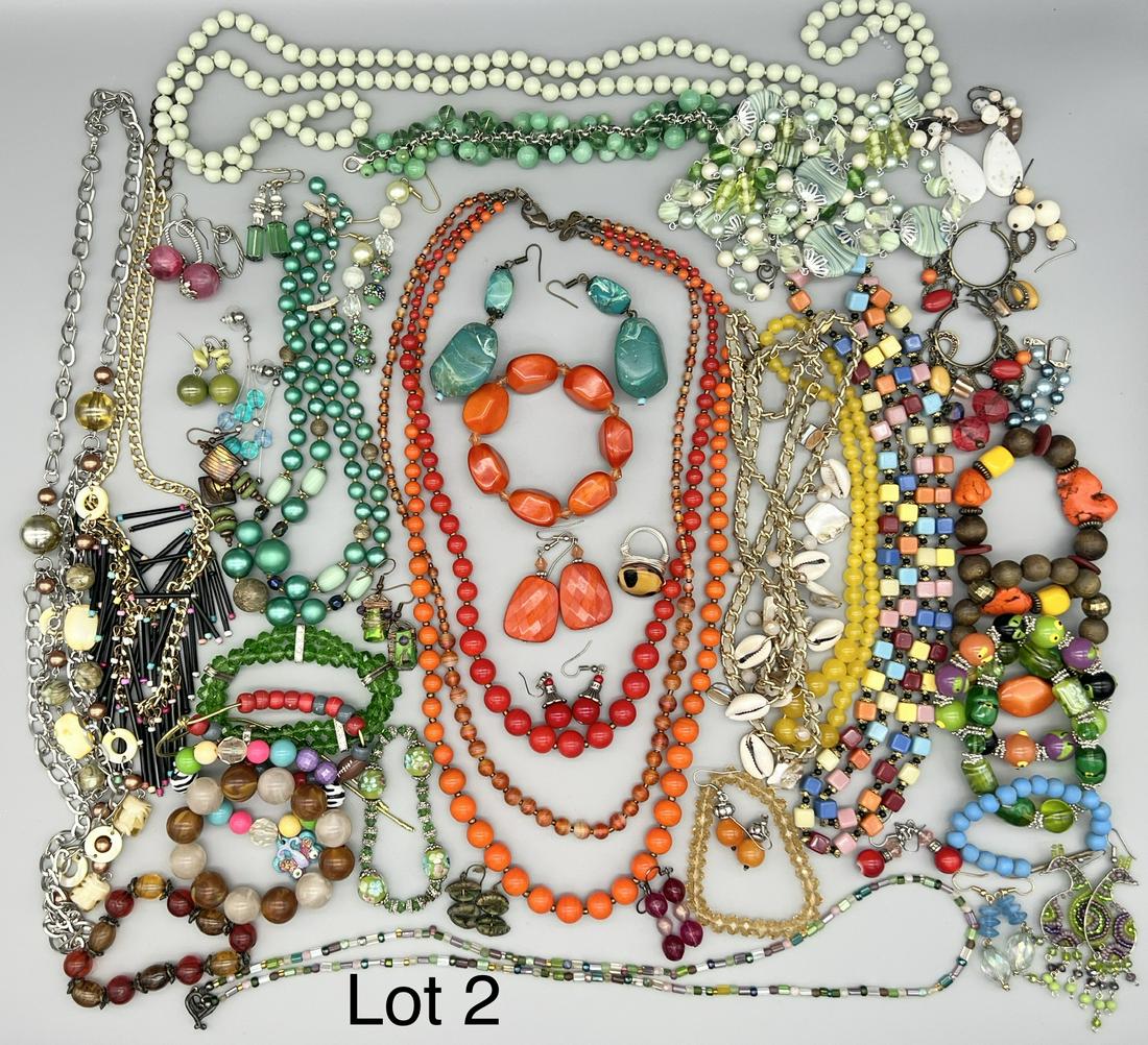 Lot of Colorful Beaded Costume Jewelry: A lot of bold and vibrant beaded costume jewelry in a rainbow of colors. Includes several bracelets, earrings and necklaces.