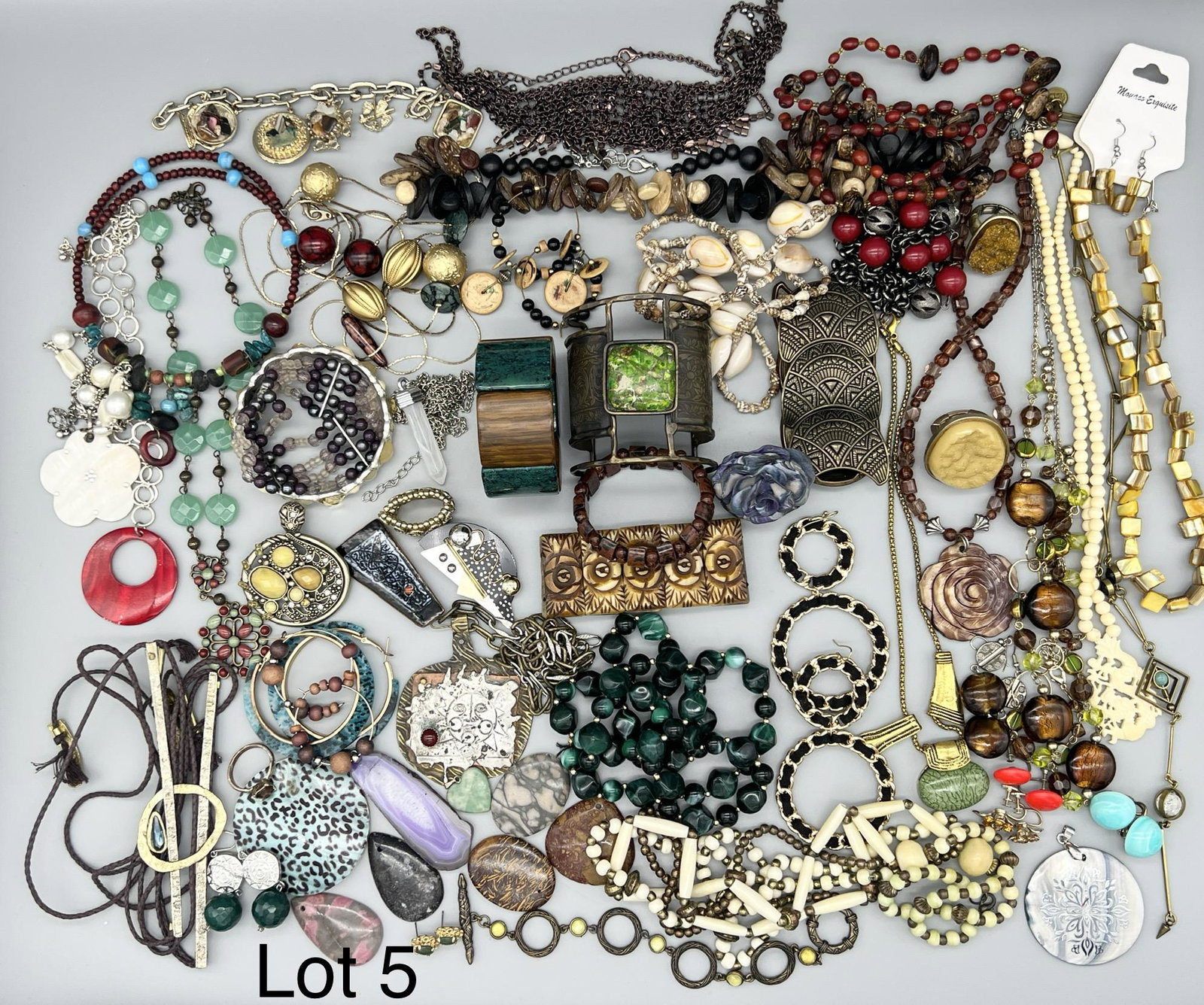 Selection of Bohemian Style Costume Jewelry: A lot of costume jewelry with unique bohemian style items including beaded statement necklaces, natural stone pendants, shell and bone pieces and many more eclectic items.