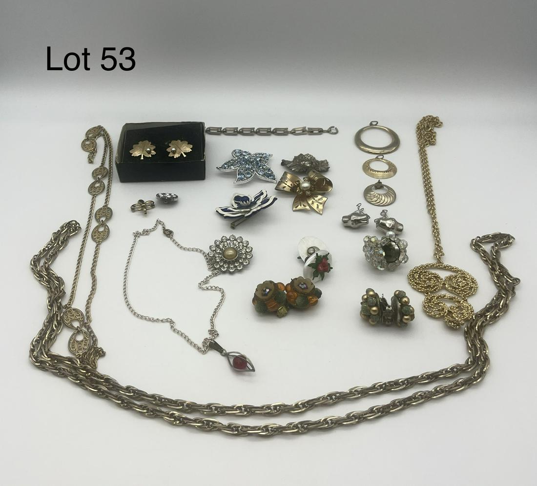 Vintage Collection of Costume Jewelry: Vintage collection of mid century costume jewelry, including a number of colorful flower and leaf pieces. Includes a mix of signed and unsigned pieces, with notable examples including a pair of leaf e