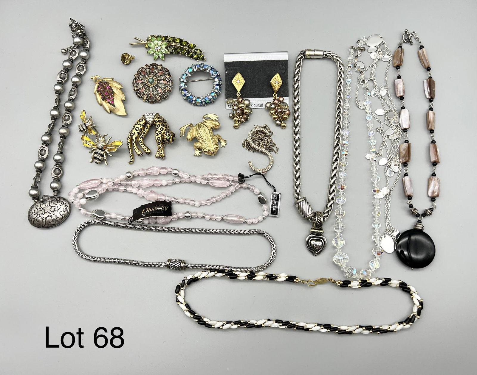 Lot of Signed Costume Jewelry: Lot of signed costume jewelry including brands such as Diversity, Liz Claiborne, Warner, Monet, Trifari and Napier.