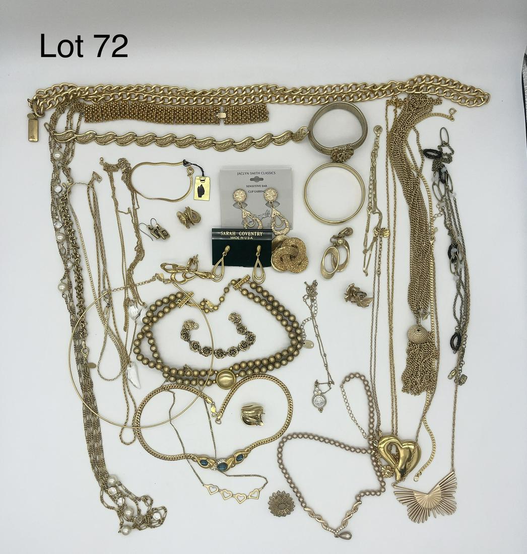Set of Gold Tone Signed Costume Jewelry: Gorgeous set of gold tone signed costume jewelry including pieces from J. Coro, Sarah Coventry, Monets, Trifari, and more. Noted with several large gold chains, earrings, and pendants.
