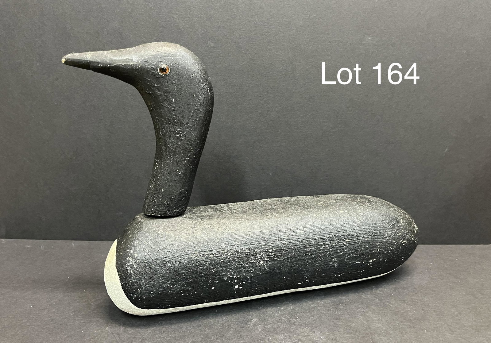 Rustic Wishart Morgan Loon Decoy: A rustic style Loon decoy with glass eyes made by Richard A. Morgan of Wishart-Morgan Makers of Woodbury, Connecticut. Very simple and rustic design. Marked "Wishart-Morgan Makers" and initialed "RAM"