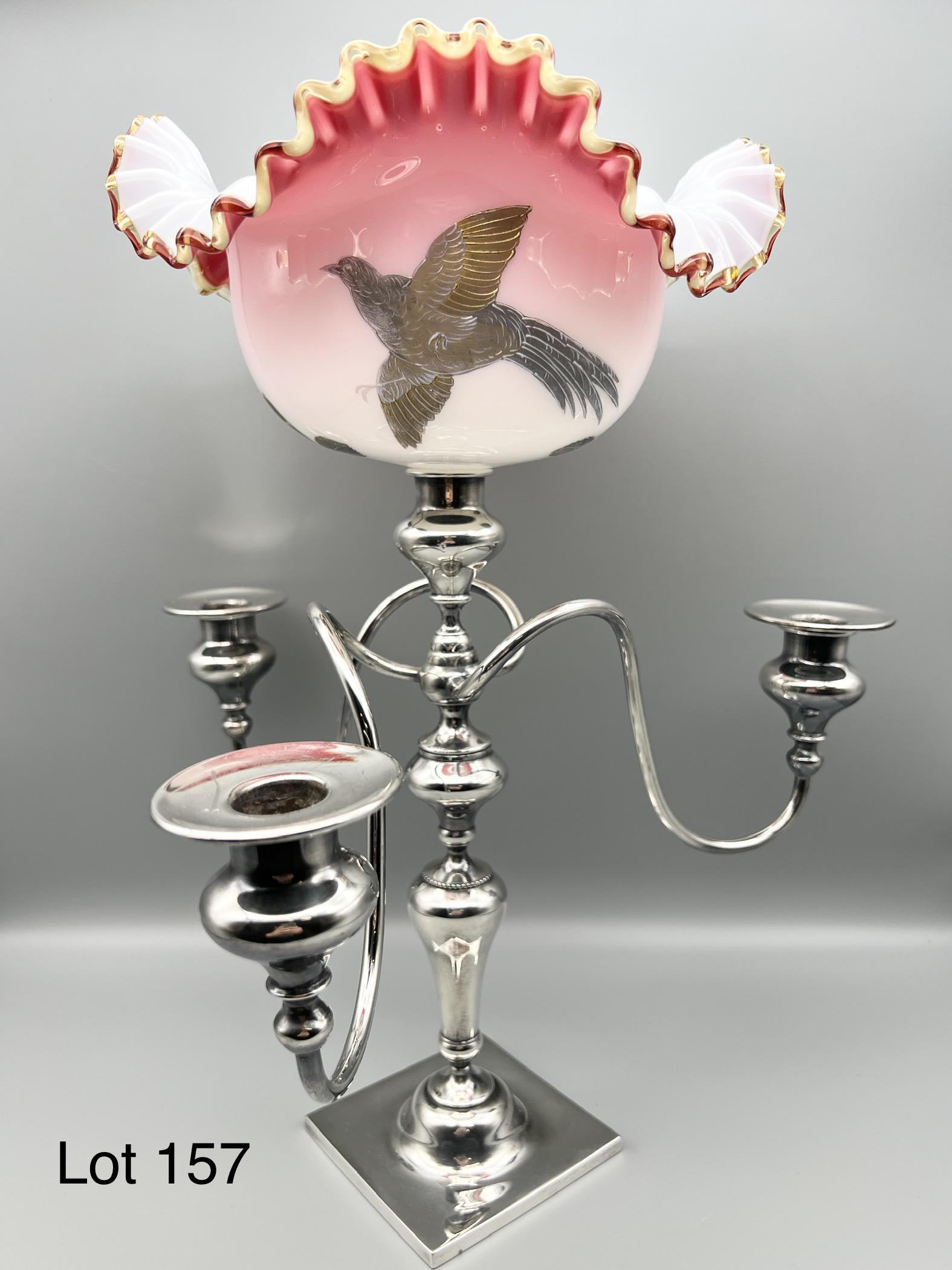 Victor Silver Co. Silverplate Candelabra with Milk Glass Shade: Quadruple plated candelabra with 3 arms made by Victory Silver Co. Center holds a ruffled edge milk glass shade with pink shading and acorn and bird design. 16" tall. Underside bares makers mark and i