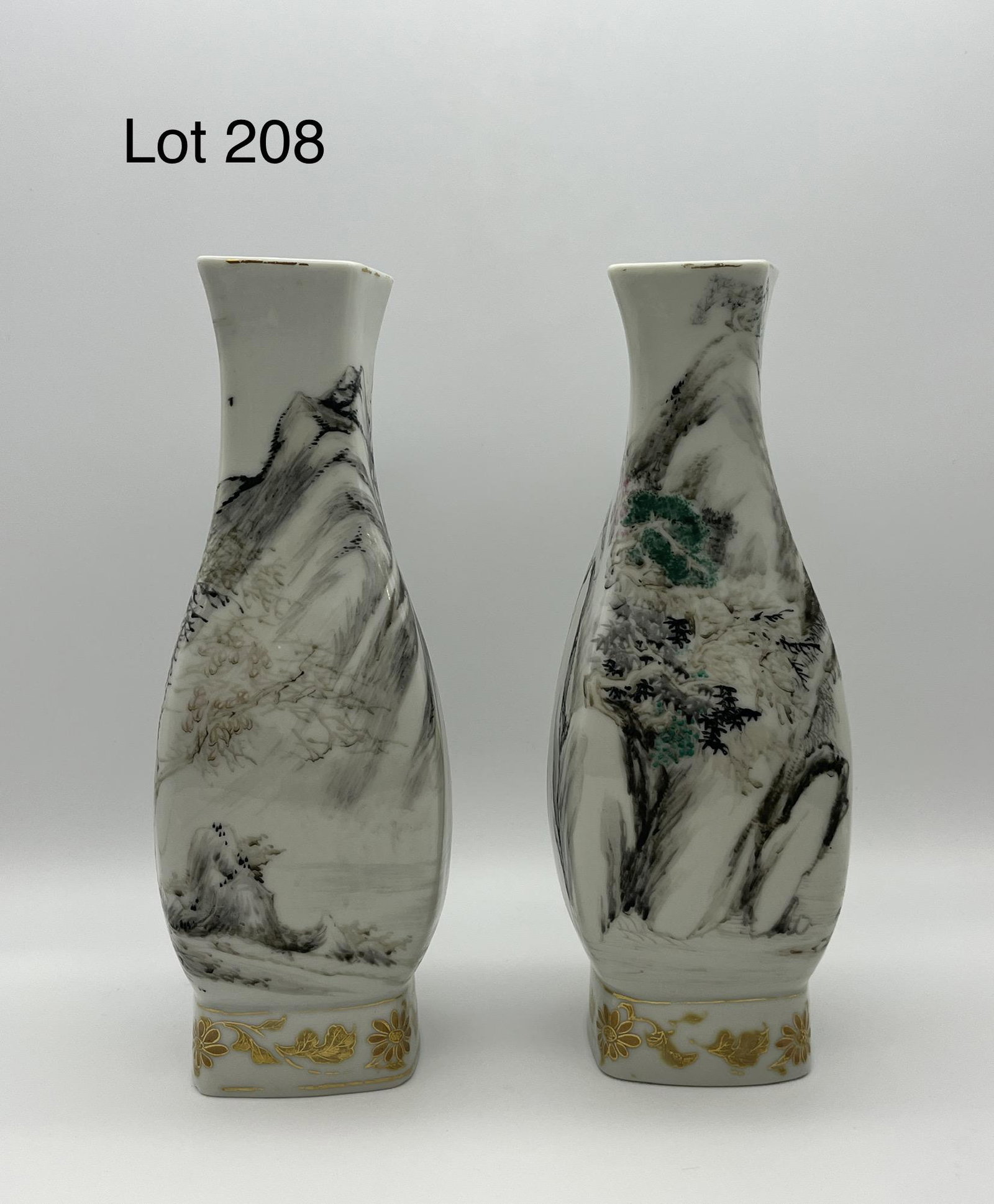 Pair of Matching Antique Japanese Flower Vases: Pair of antique Japanese flower vases with design work of people in nature scenes. Diamond opening, eight characters on bottom. One slightly taller than the other, measures 10 1/2" tall.