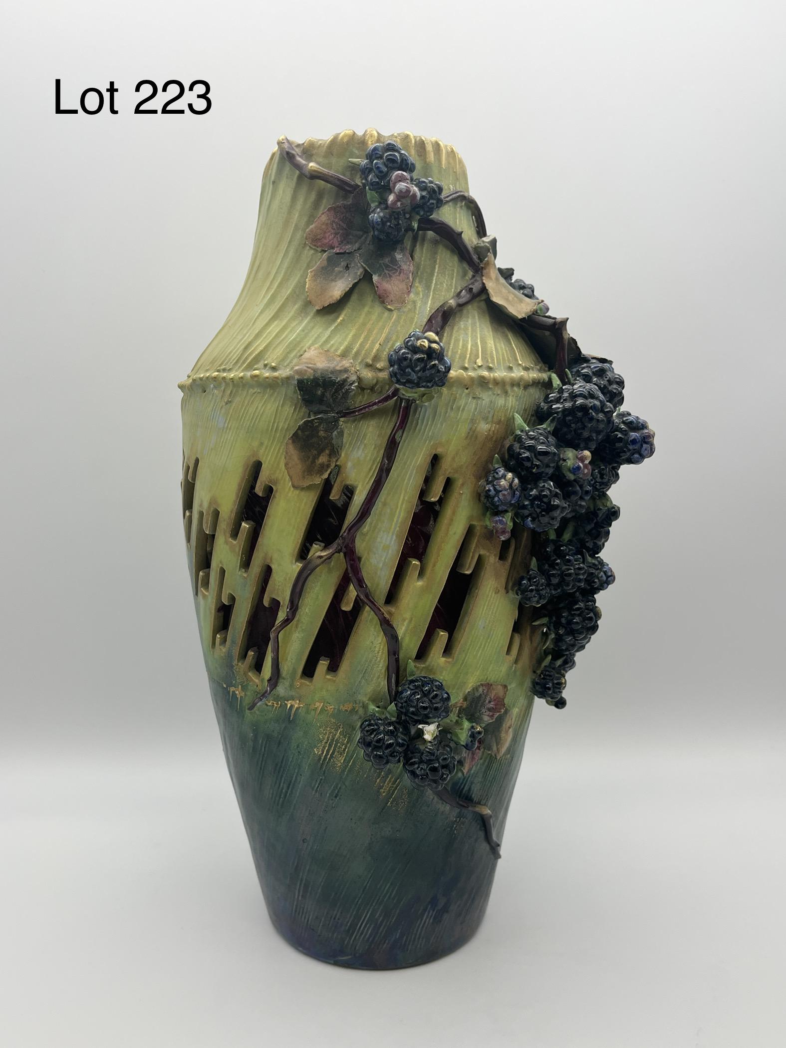 Large Amphora Cut-out Vase with Berry Motif: Large Amphora flower vase decorated with applied leaves and berries. External glaze in bright blue-green gradient, while geometric cutouts show second interior vase with glossy sheen. Rare piece, make