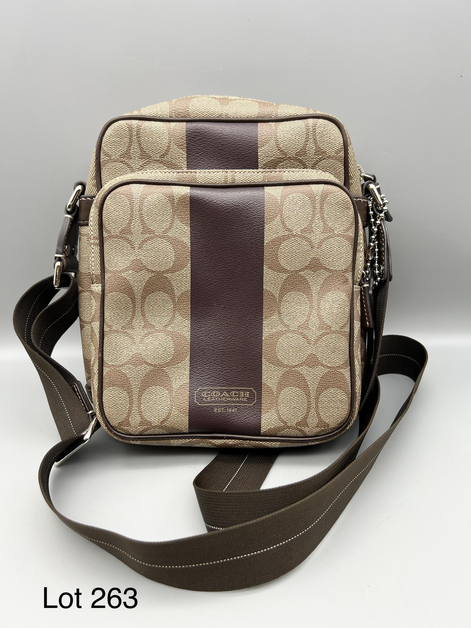 Coach Heritage Stripe Flight Crossbody Bag: An authentic Coach Heritage stripe flight crossbody unisex bag with classic monogram pattern. Adjustable canvas strap. Dual zipper compartments. Serial #F1168-F70078. Dimensions are 9" x 8" x 3". Mild