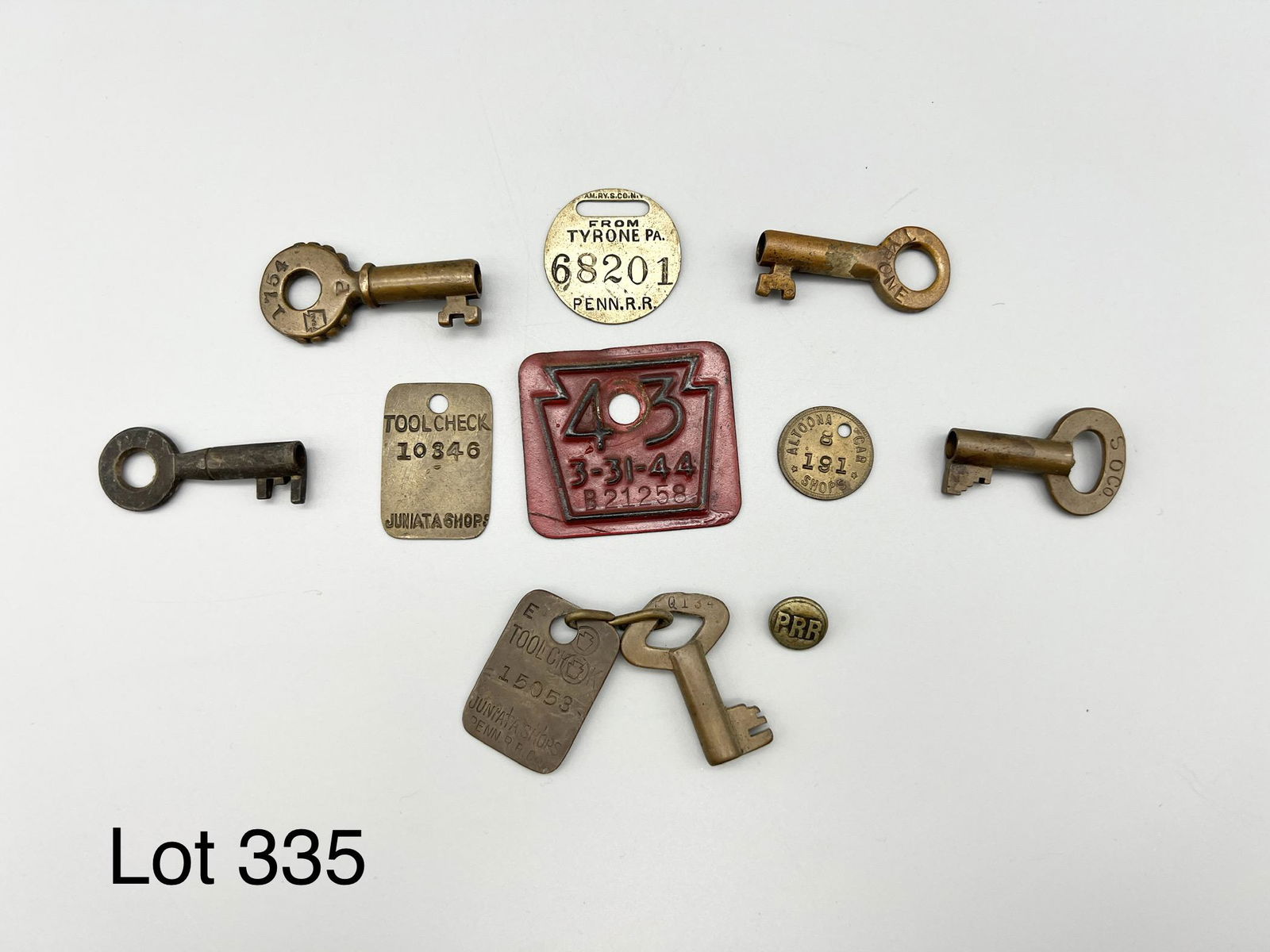 Lot of Antique Keys and Badges: Lot of antique railroad keys, railroad badge keychains. Many from Pennsylvania Railroad. PRR button. 1944 license plate metal Keystone tag .*notes- patina with age.