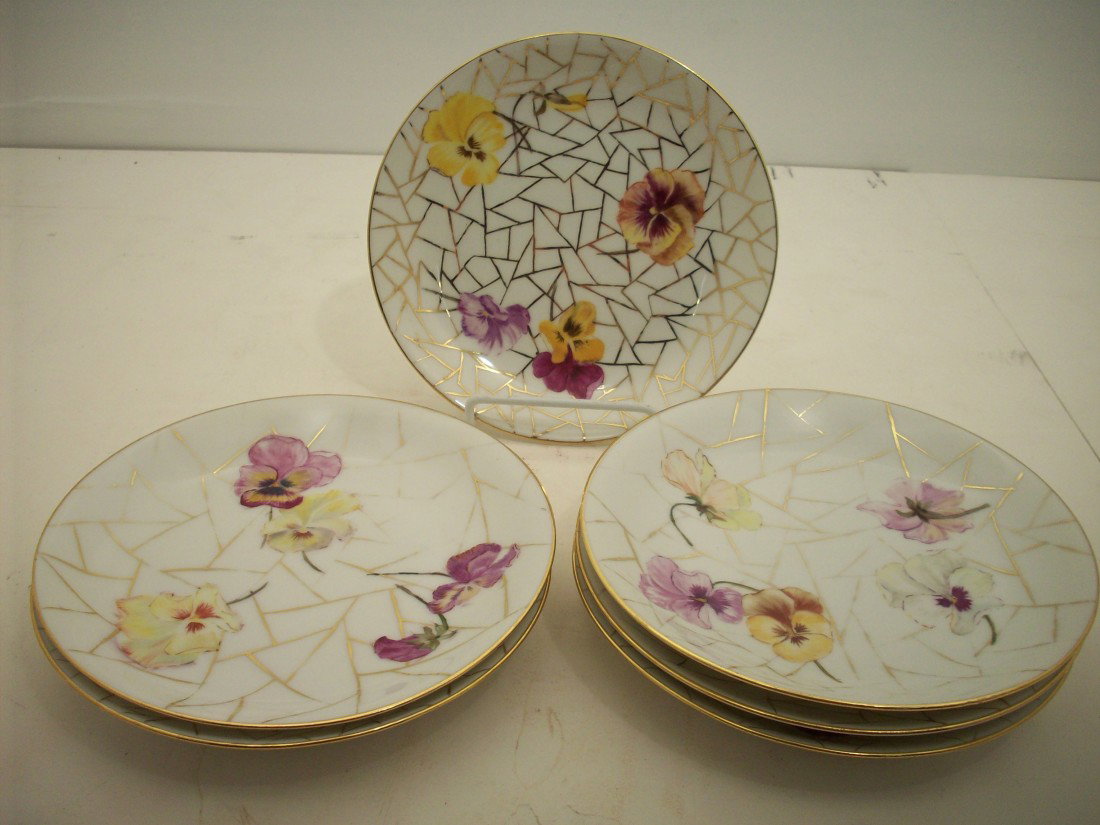 6 Havilland & Company Pansy Plates: 7 1/4" plates with gold colored shape design with pansy flowers, gold rim, all are marked: H&Co (over "L") in green. Limoges France, 4 are marked with painters initials, and one has an inscription dat