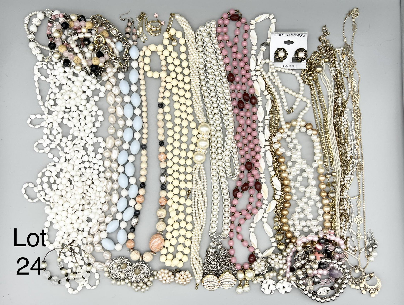 Lot of Muted Tone Costume Jewelry: A lot of costume jewelry in muted tones. This group features beaded necklaces, bracelets and earrings and more.