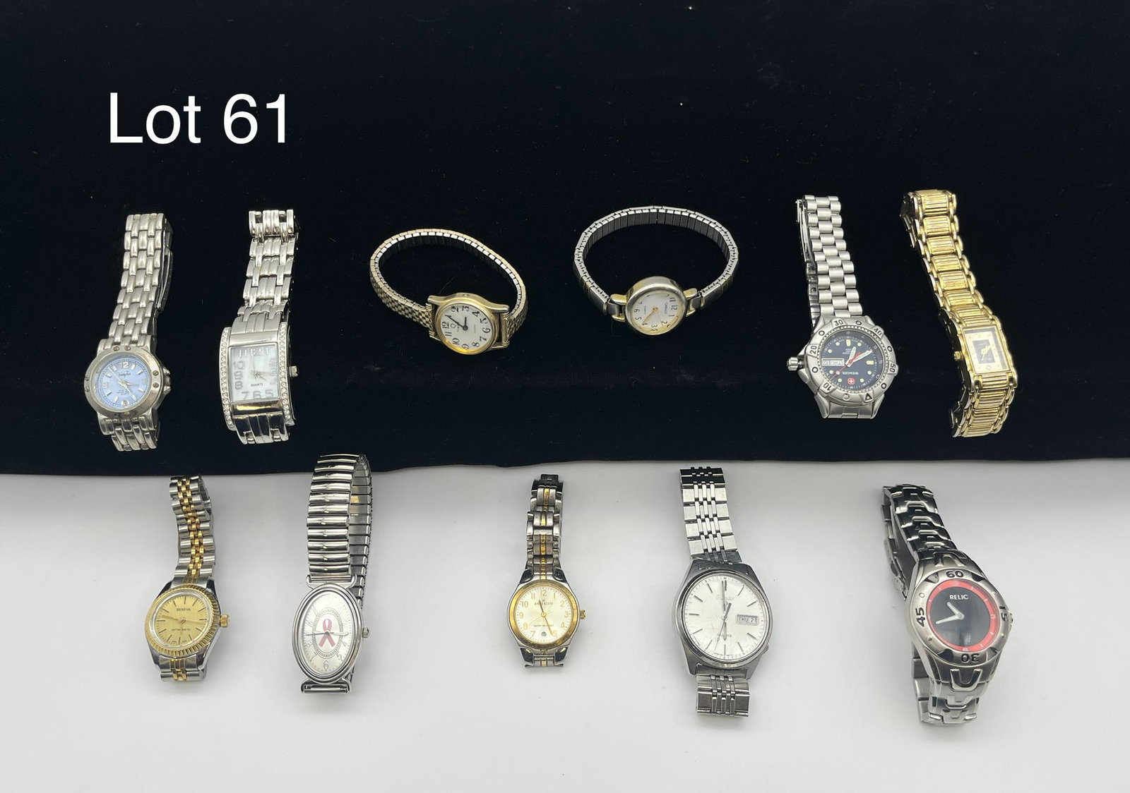 Mixed Lot of Gold and Silver Toned Wrist Watches: Mixed lot of eleven gold and silver toned wrist watches with metal straps. Lot includes pieces from Waltham, Wenger, Relic, Carriage, Pulsar, Timex, Vanity Fair, Geneva, Anne Klein, and more.
