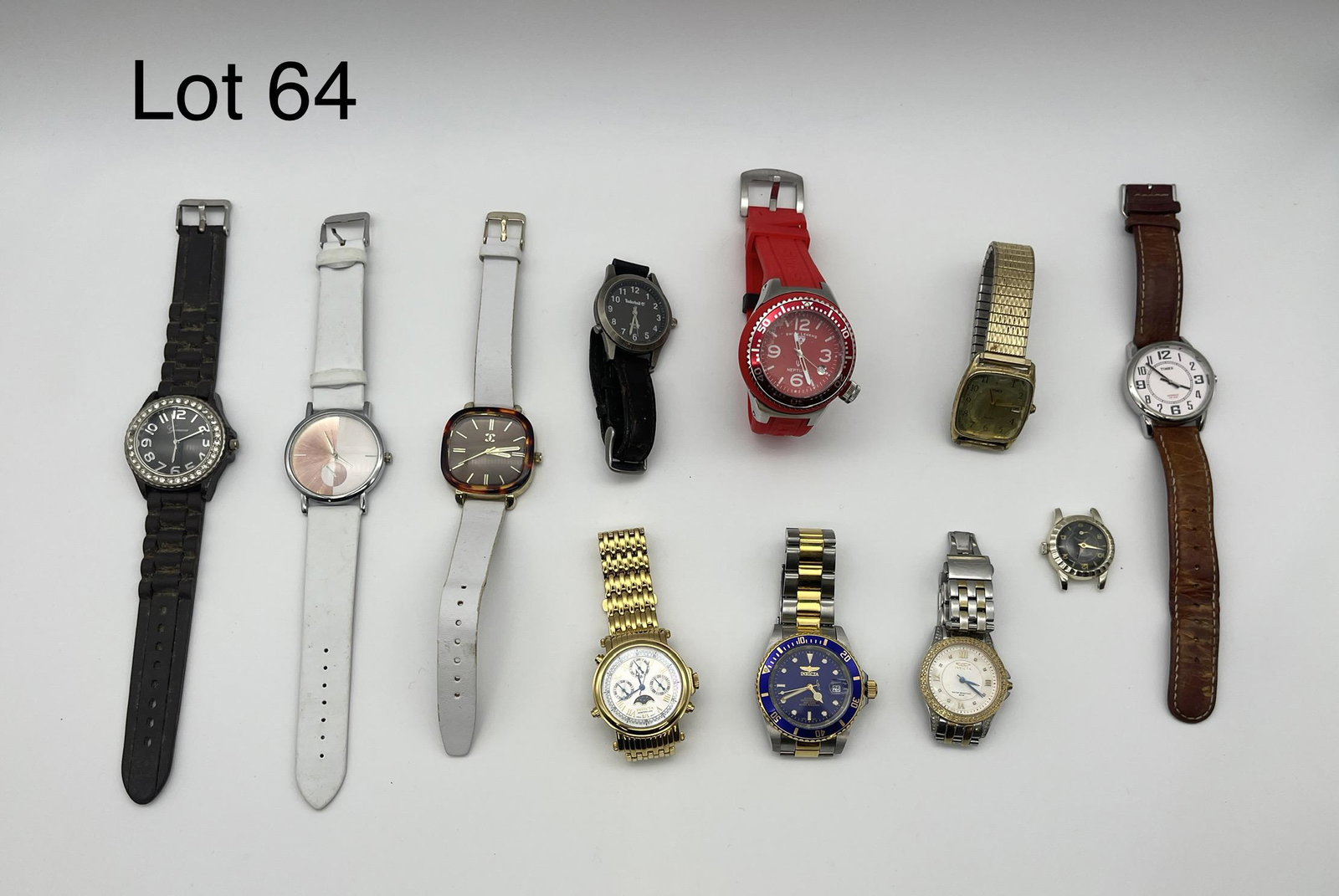 Lot of Men's Wrist Watches: Lot of eleven men's wrist watches, including pieces from Timex, Invicta, Geneva, Harvester, Swiss Legend - Neptune, Timberland, and more. *note - one piece without straps