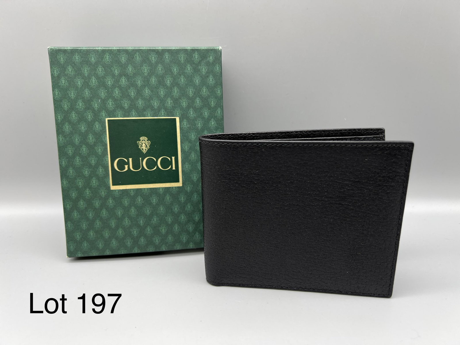 Vintage Gucci Black Leather Wallet: Gucci black leather bi-fold wallet. 4 1/2" x 4". In original box. *notes- box has torn mark from price sticker.