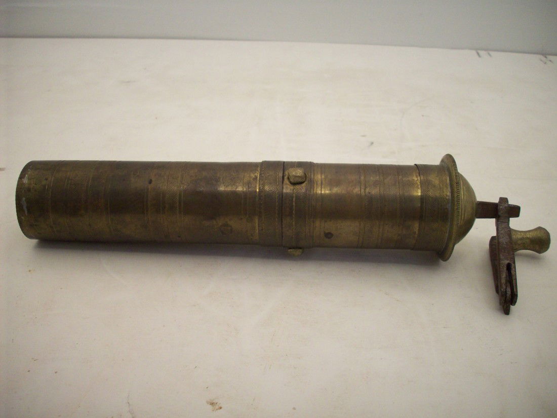 Indian Spice Grinder: 10 1/2" X 1 5/8" diameter, all metal construction, folding crank handle, bottom slides off exposing ground spices
