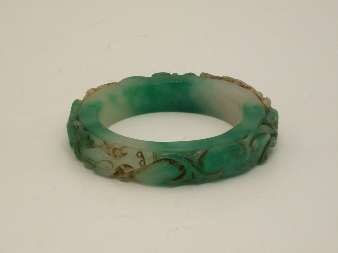 Carved Spinach Jade or Jade-like Material Bangle: China. 3 1/8" X 1/2", bangle with carved lizards in excellent condition