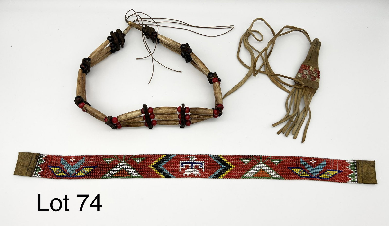 Lot of Handmade Accessories: Lot of 3 items. Includes a tiny porcupine quill decorated skin bag, loom beaded band and bone and glass bead choker. Shipping dimensions are 9 1/2" x 5" x 1 1/2".