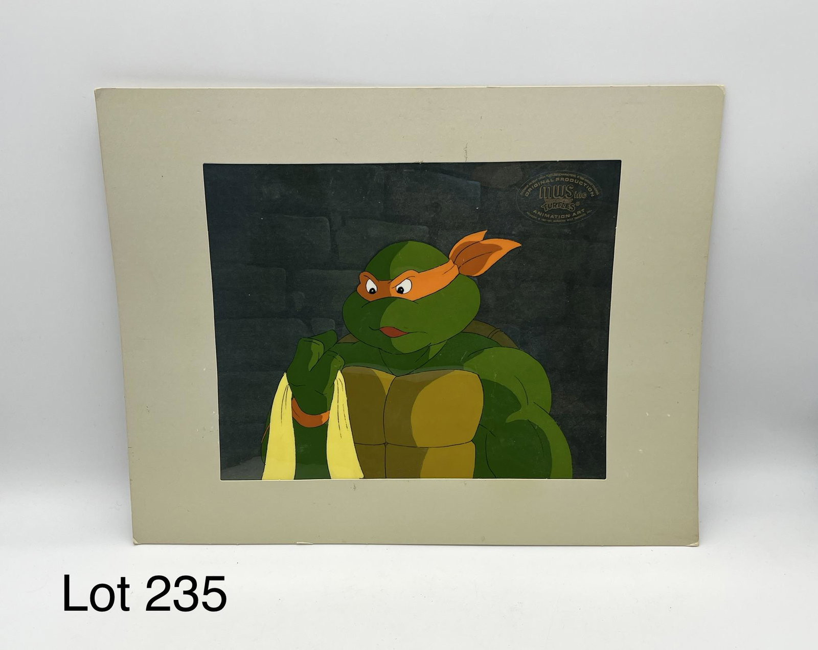 TMNT Animation Art from Murakami-Wolf-Swenson: An original painted Teenage Mutant Ninja Turtles production cell of Michelangelo from Murakami-Wolf-Swenson Inc., marked in the top right corner. Measures 14" x 11", 9 3/8" x 7 3/4" site.