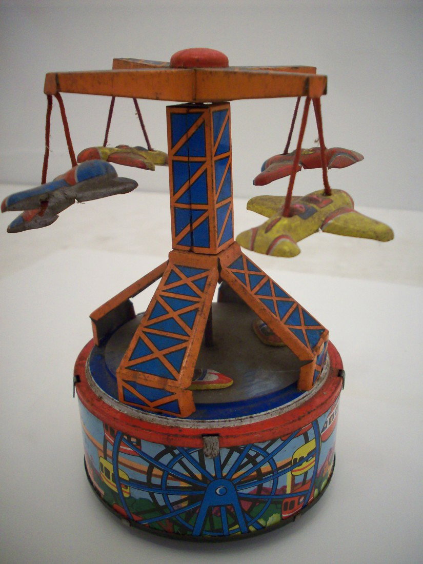Yone Tin Litho Windup Toy: 5 1/2" tall X 4 1/2" wide, Made in Japan by Yone, when on planes and boats spin and a bell rings, great working condition