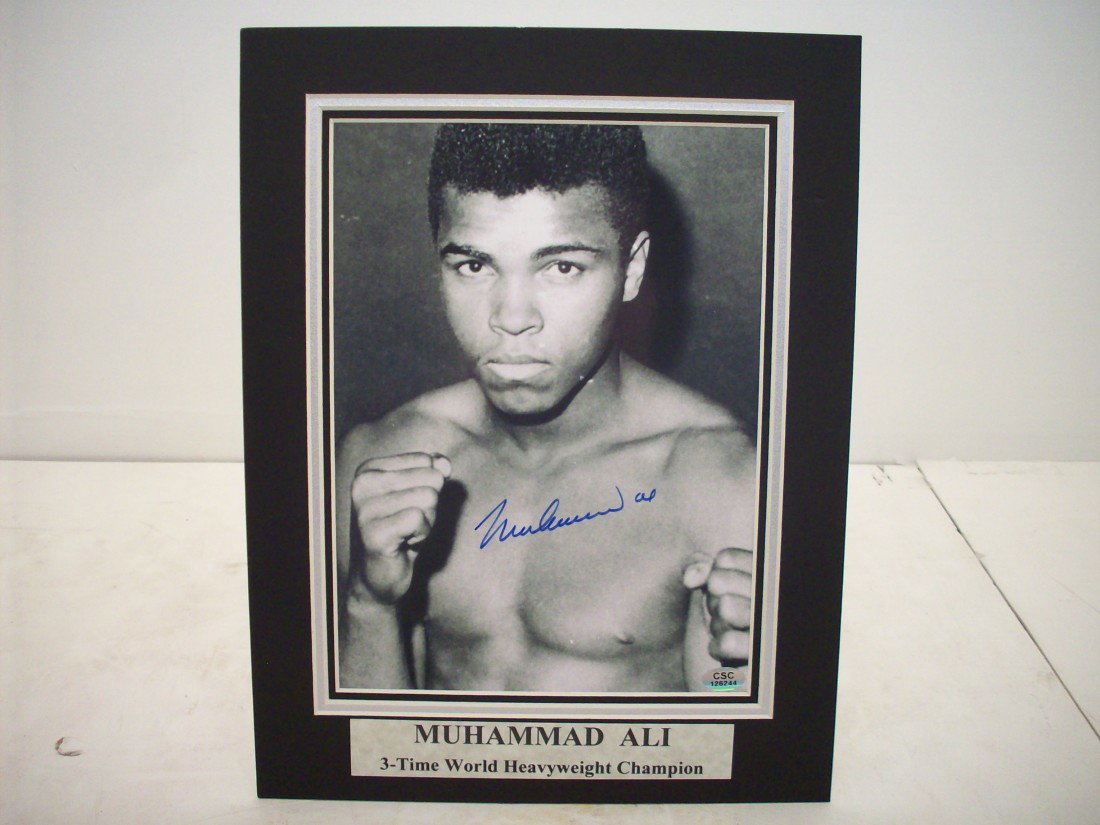 Muhammad Ali Autograph: Matted black and white photo. Excellent condition, Includes Certificate of Authenticity