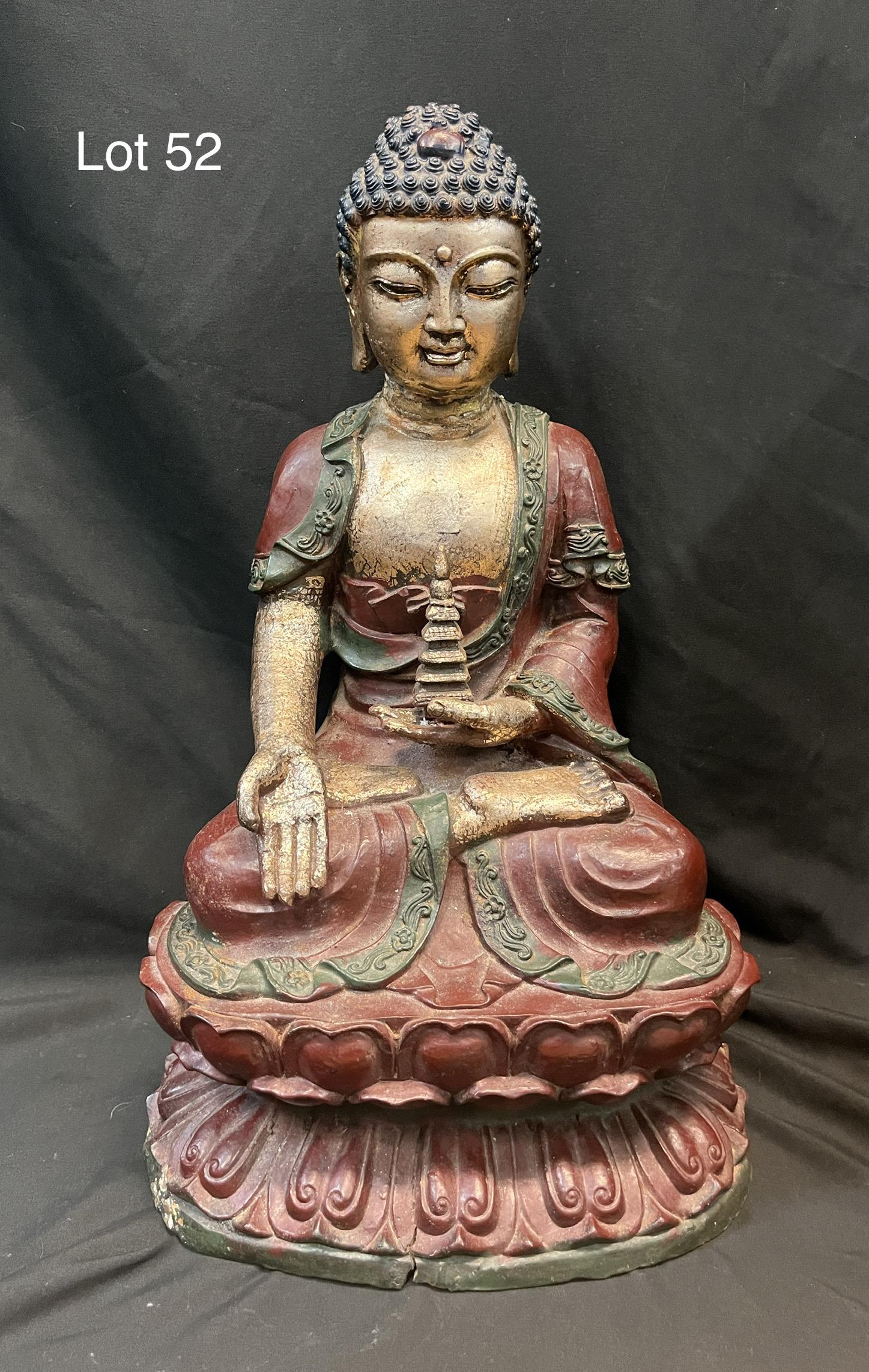 Cast Iron Buddha Statue: A cast iron buddha statue with gilt painting, one hand is palm up while the other holds a small temple. No makers marks, figures measure 20" tall, 12" at base. *note - some cracking noted, wear to pai