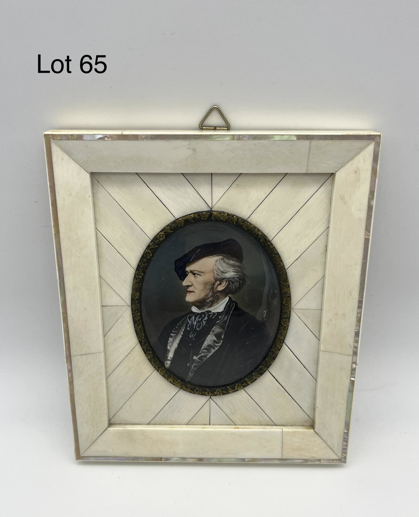 Porcelain Portrait of Richard Wagner in Bone Frame: A small-sized hand painted portrait on porcelain of composer Richard Wagner, signed along the right. Frame is in carved bone, and measures 5 1/4" x 6". *notes - backing shows German text