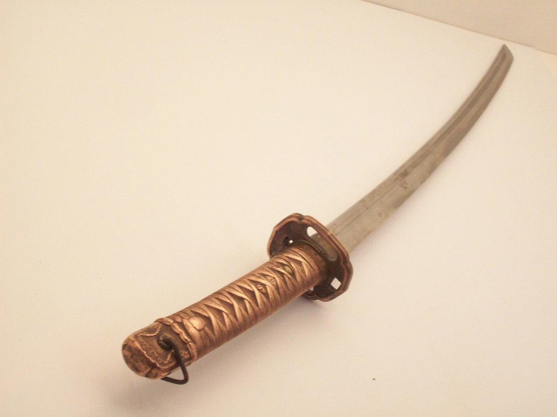 Japanese WWII NCO Sword: Copper handle machine made sword issued to Non Commissioned Officers in Japanese Army. The blade and scabbard (saya) have matching number 15508, blade is straight