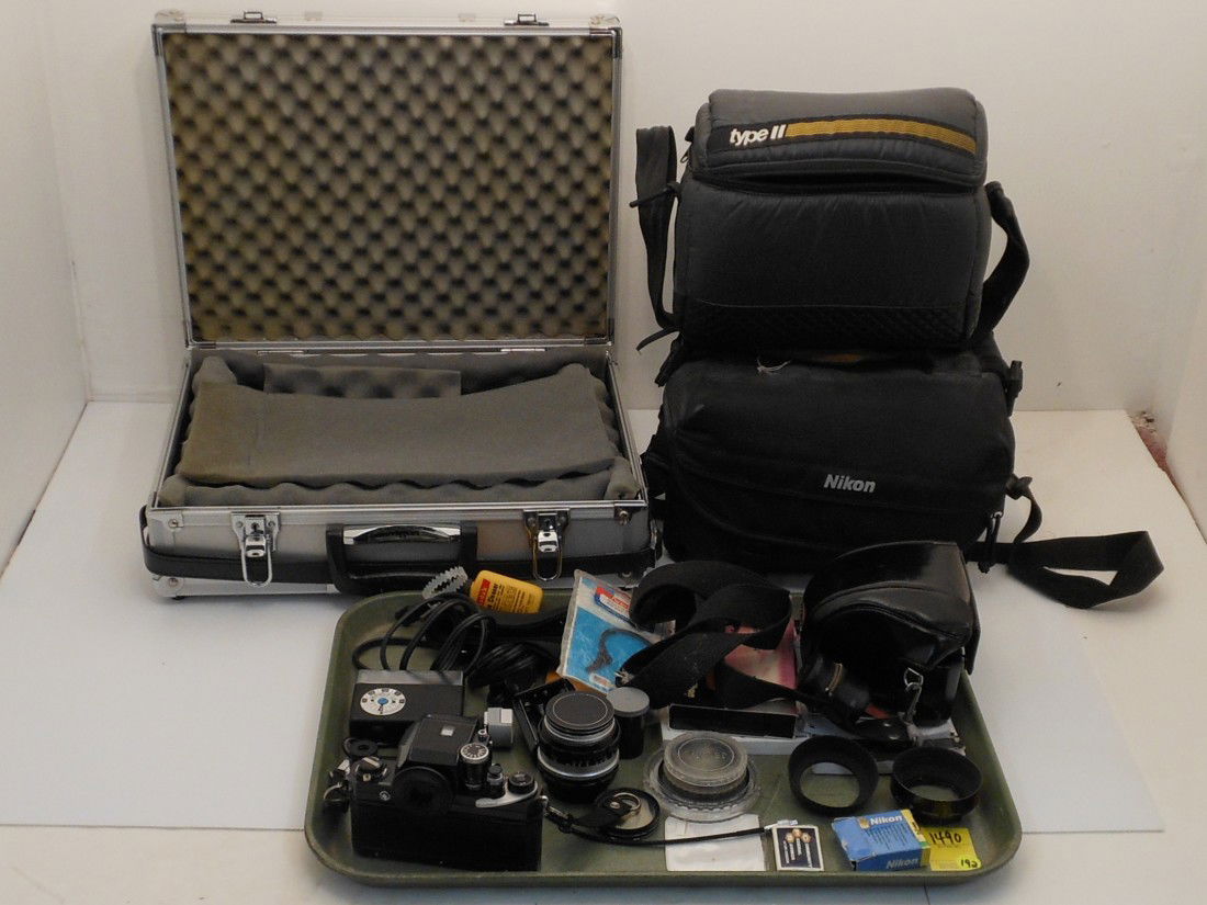 Nikon F Photomic Apollo Black Camera Plus Extras: Nikon F photomic camera Apollo black FTn metered prism, Nikkor-O auto 1:2 35mm #766624 lens, Nikkor-S Auto 1:1.4 50mm lens with end caps #711219, four filters, two hoods, extra focusing screens, flash