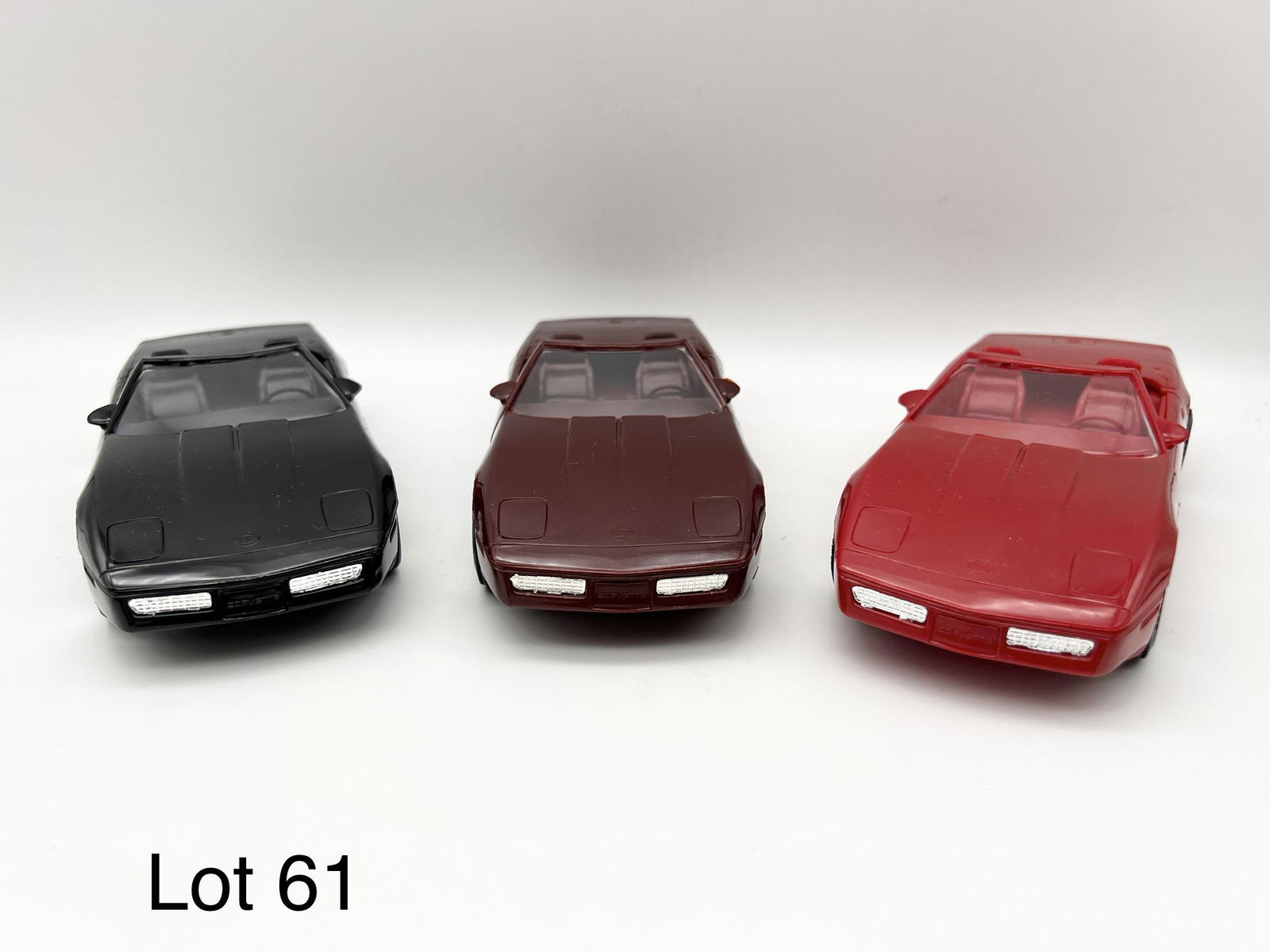 Trio of AMT-Ertl 1980s Model Corvettes: Group of 3 AMT-Ertl 1980s promotional model chevrolet corvettes in original boxes. Includes a 1987 red Corvette (#6274EO), a 1988 dark red Corvette Roadster (#6095EO) and a 1989 black Corvette Convert
