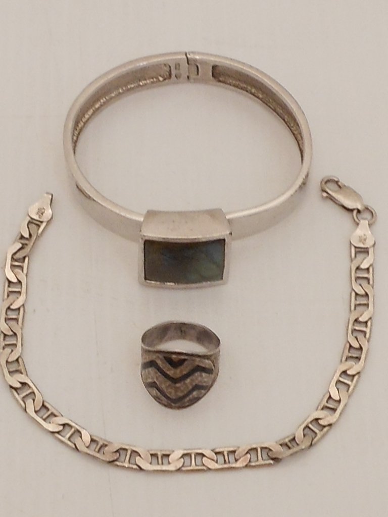 Sterling Silver Jewelry Lot: Lot of 3. Women's bracelet with large square abalone . 8" link bracelet and size 6 ring with black onyx. All are marked and in great used condition.