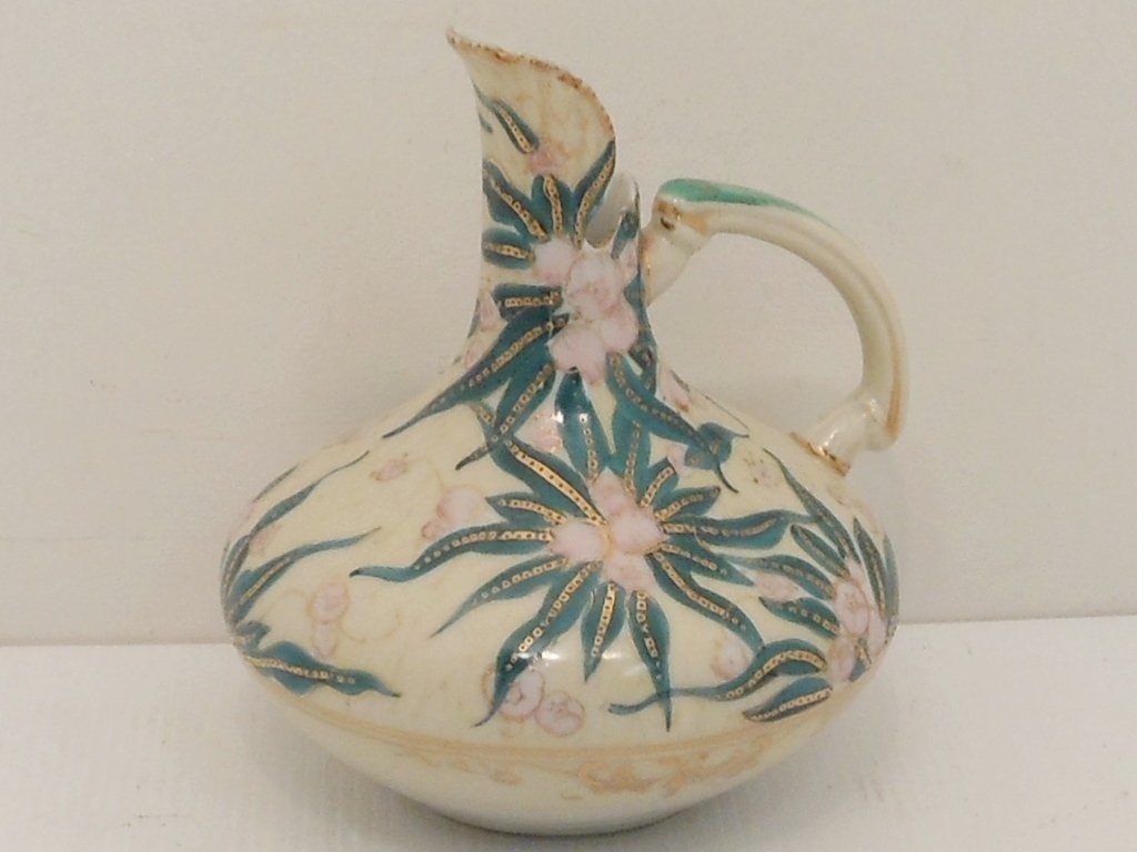 Antique Nippon Ewer: 6" tall X 5 1/2" wide, circa late 19th century, White porcelain cream colored with floral, gilt and gilt moriage decorations, unmarked, excellent condition with minor gilt loss