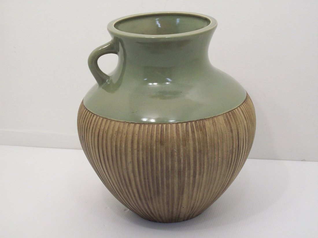Large Bulbous Pottery Incised Vase with Handle: 13" tall X 11" wide, incised with vertical lines gold colored with rough glaze, top section has green smooth glaze and a loop handle, 6" mouth, unmarked, great condition