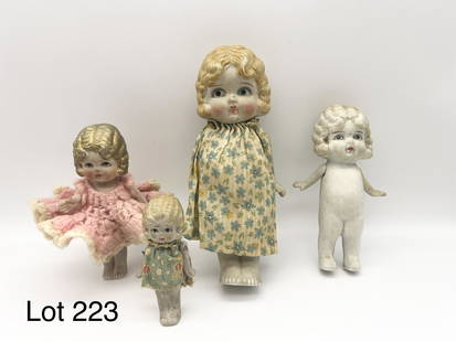 Group of Frozen Charlotte "Flapper Girl" Bisque Dolls: Lot of 4 Frozen Charlotte bisque "Flapper Girl" dolls with jointed arms. All made in Japan. Largest is 7" tall and smallest is 3 1/2". *notes- some wear throughout, clothing is torn and stained.