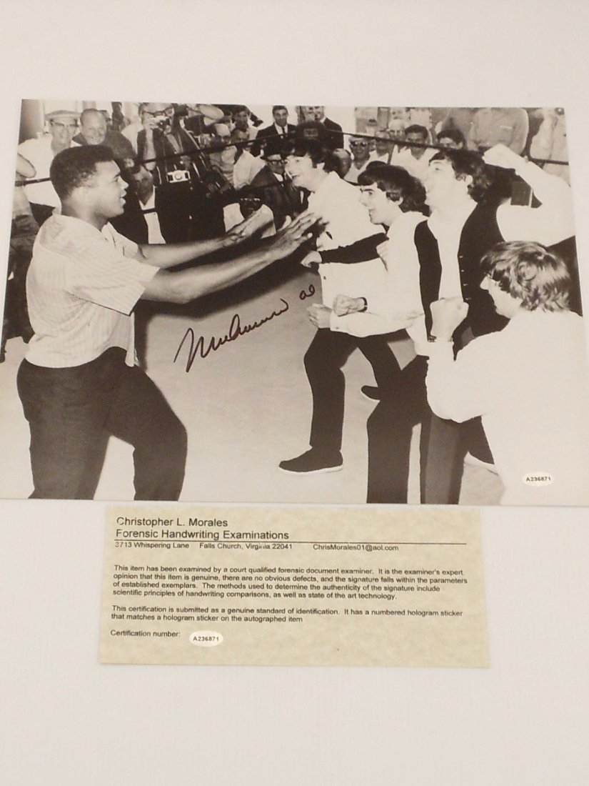 Muhammad Ali Autograph Photo with The Beatles: 11 X 14 black and white photo of Muhammad Ali in the ring with The Beatles, sleeved, Christopher L. Morales COA