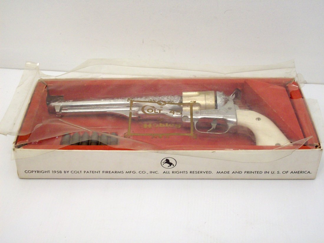 Hubley Colt 45 Cap Gun in The Box with Bullets: Circa 1950's, Hubley Colt 45 Cap Gun in a very lightly used condition , if at all. Includes six two piece shells, original box and the plastic cover. Gun is in excellent condition, box has splits and
