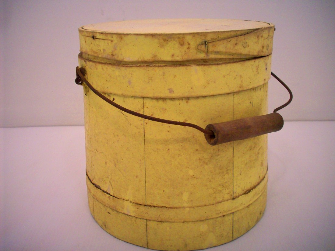 Painted Wood Firkin: 7 3/4" tall X 8 1/4" widest, Yellow painted wood firkin with finger joints, metal / wood bail handle, lid fits tight, great condition…needs a good cleaning.