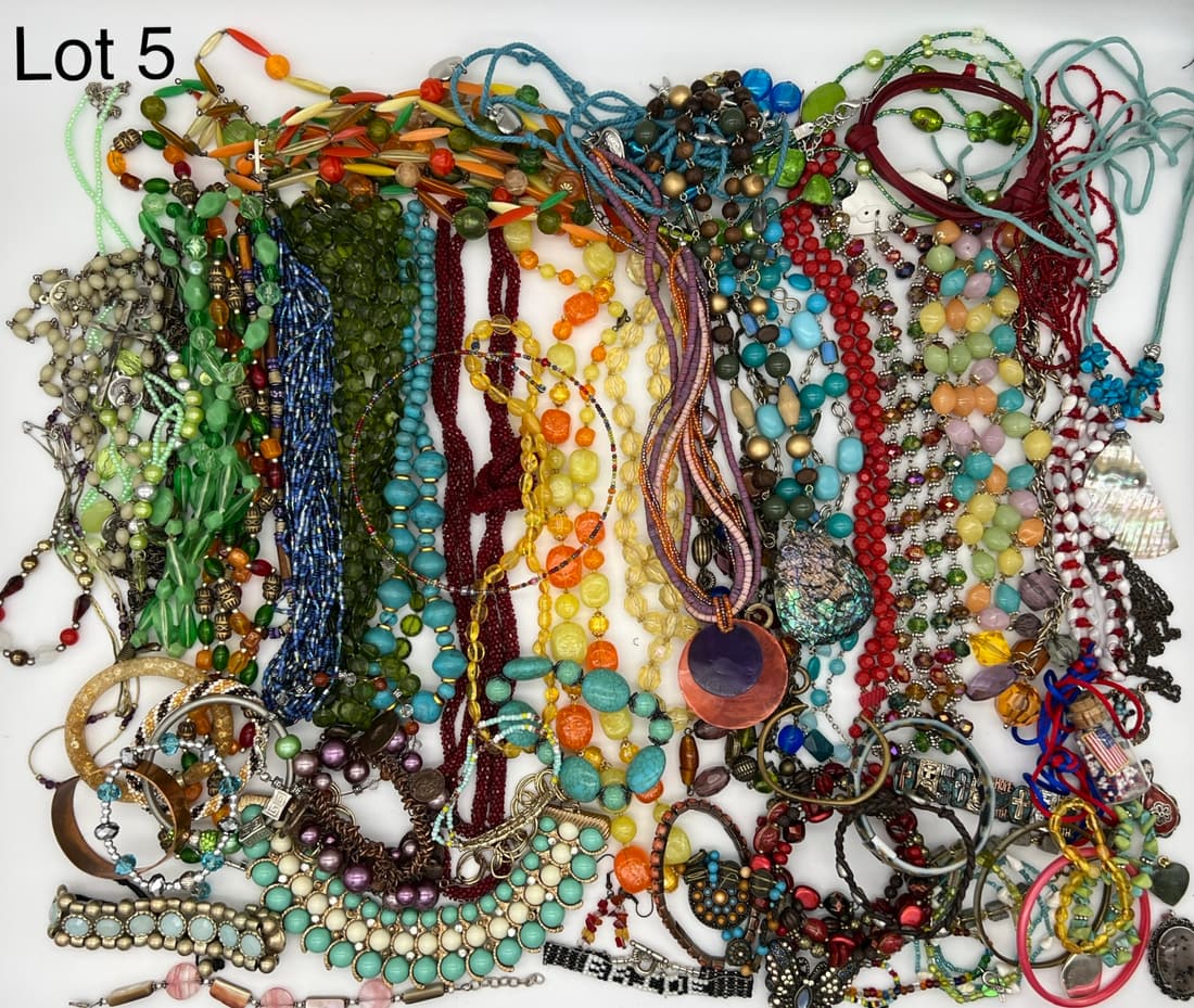 Vibrant Selection of Costume Jewelry Including Beads: Bright and colorful group of costume jewelry including many beaded necklaces and bracelets.