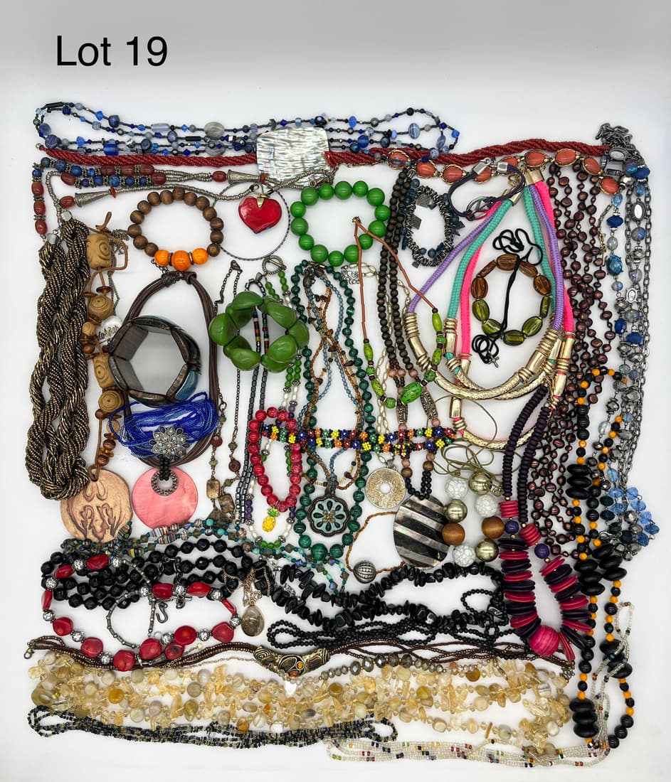 Vibrant Lot of Boho Costume Jewelry Including Statement Necklaces: A vibrant lot of bohemian style costume jewelry featuring eye-catching statement necklaces with other pieces in stone, wood, fiber, and more unique materials.