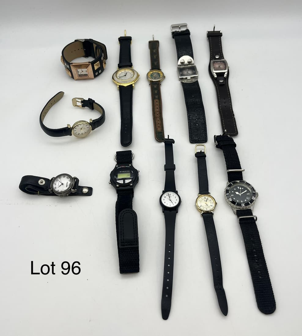 Lot of Watches in Black with Gold Tones: Lot of eleven wrist watches in black with gold tones. Includes pieces by Mudd, Timex, PS, Aqualite, and more.