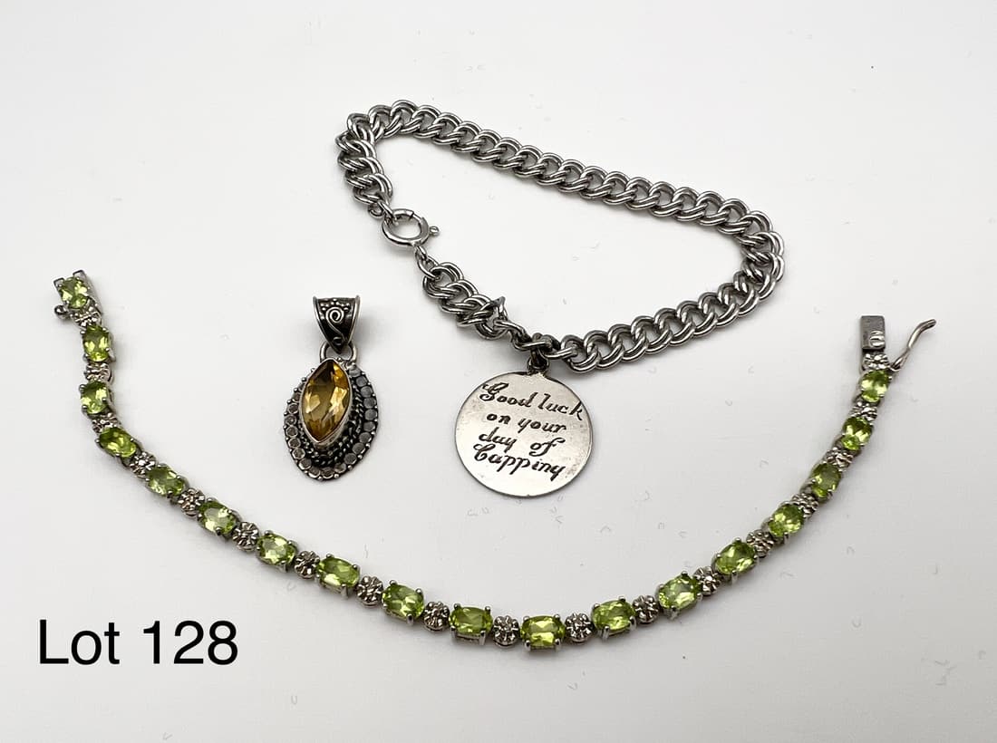 Sterling Silver Lot Featuring Bracelets and Pendant: Lot of sterling including an engraved charm bracelet, a peridot bracelet and a citrine pendant.