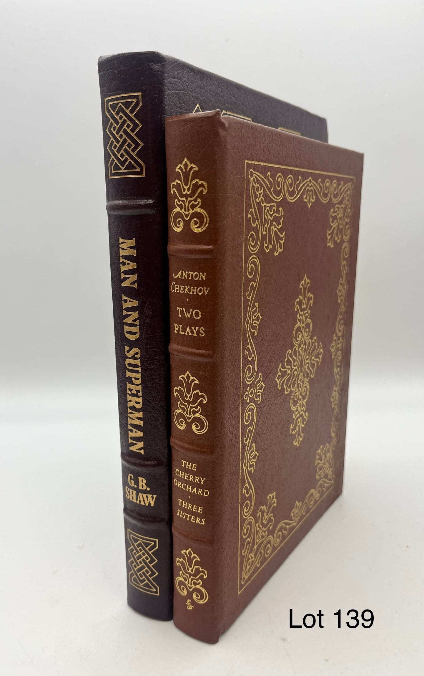 Duo of Easton Press Editions of Turn of the Century Plays: A duo of Easton Press editions of early 20th c. plays. Lot includes: "Two Plays of Anton Chekhov: The Cherry Orchard and Three Sisters" and "Man and Superman" by George Bernard Shaw. Leather bound wit