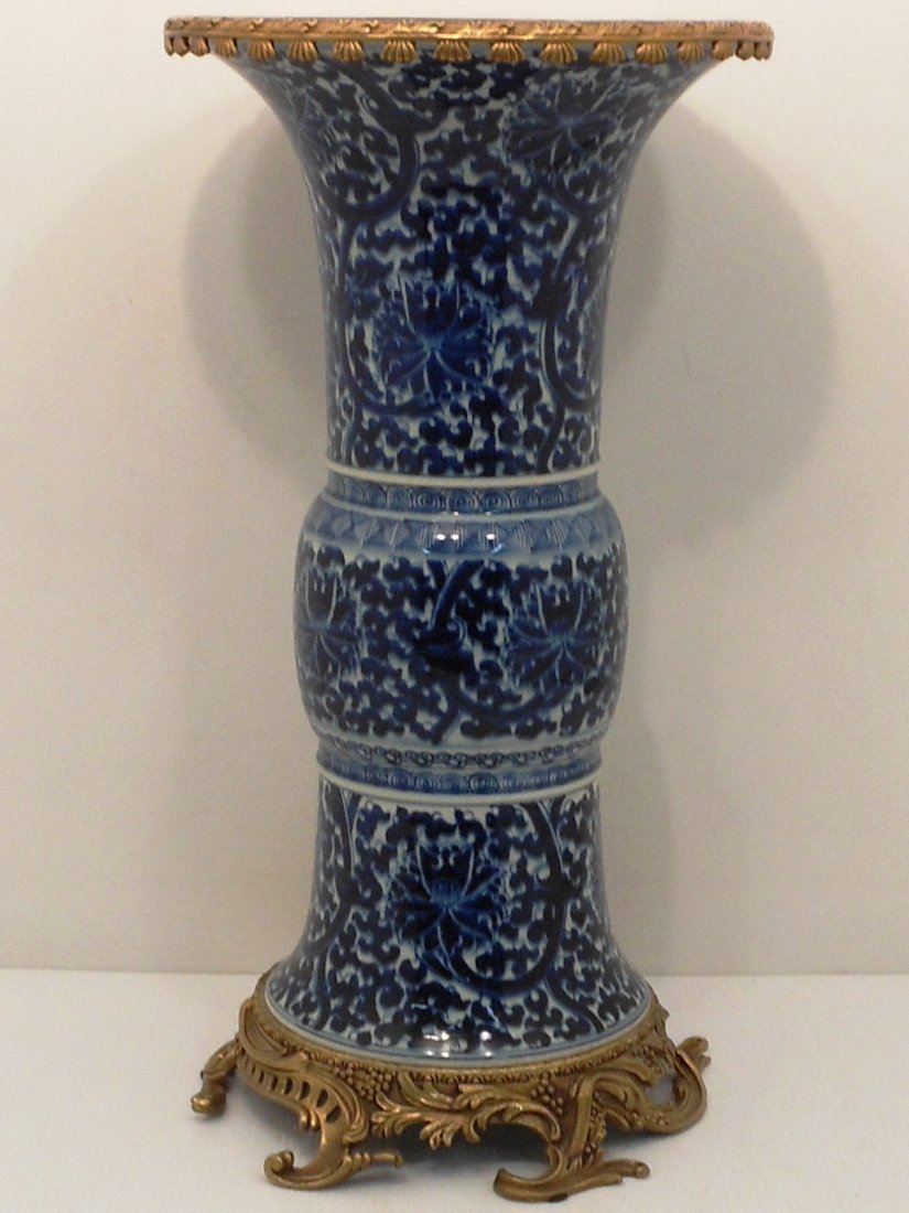 Antique Blue and White Porcelain Yen Yen Vase: China, 21" X 11 1/2", porcelain vase decorated in blue with a floral motif, attached gold colored metal base and rim, unmarked, great condition.