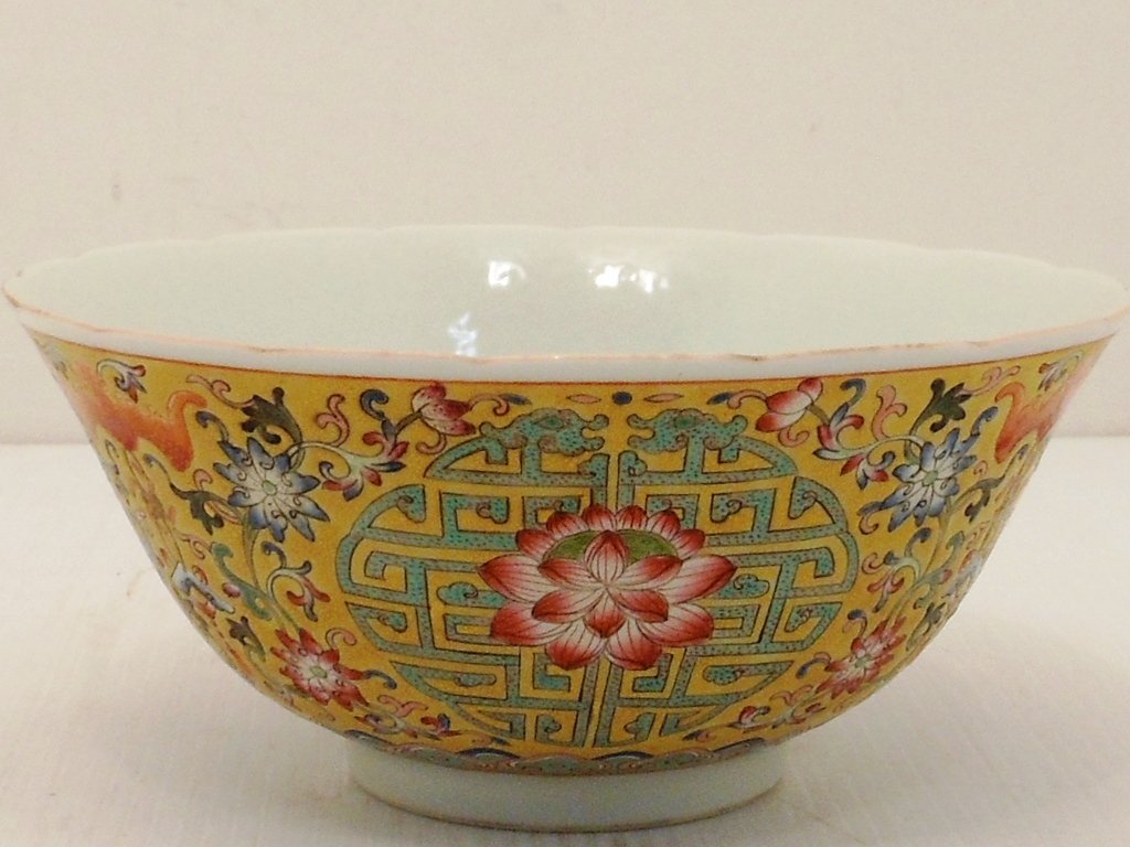 18th Century Famille Jaune Bowl: China, 3" tall X 6 5/8" diameter, porcelain bowl decorated with lotus flowers, iron red bats, floral designs on a yellow background, marked, excellent condition