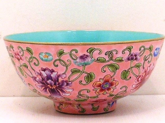 Enamel Porcelain Bowl: China, 2 3/4" tall X 5 3/4" diameter, porcelain bowl with floral decoration s on a pink background, interior is turquoise colored, gold bands on rims, marked, great condition
