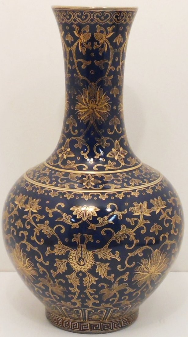 Gilt Blue Vase: China, 15" tall X 8 1/2" wide, bulbous body with a flared neck, decorated in gold colored gilt scroll work and bands, marked, excellent condition