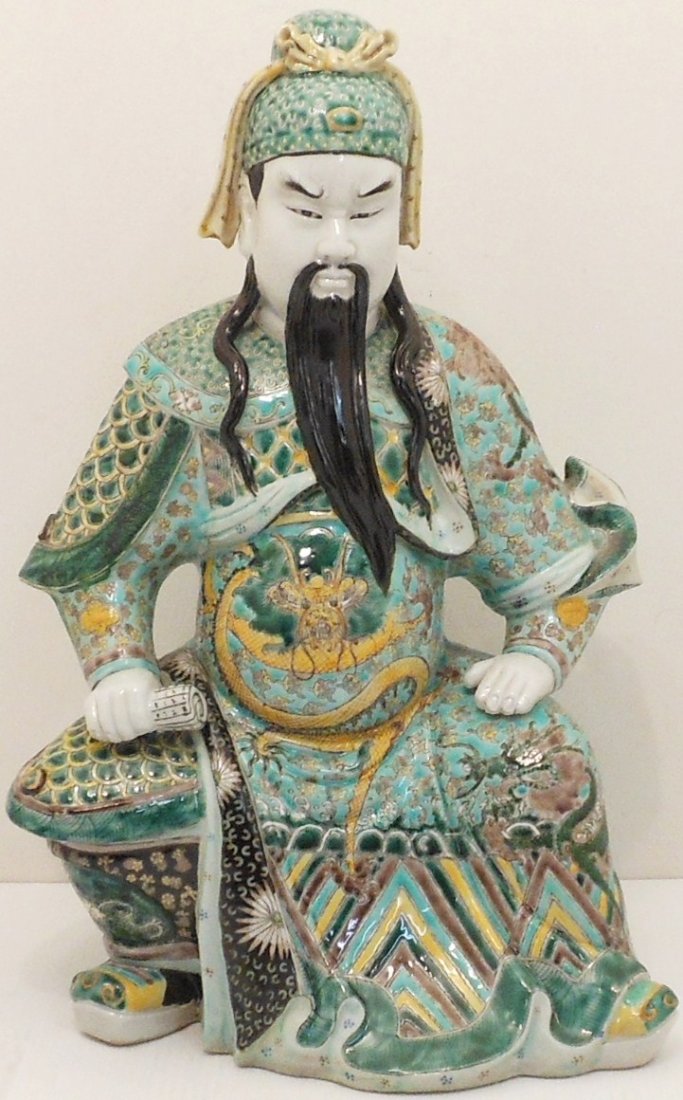 Famille Verte 20th Century Zhenwu: China, 15" tall x 10" wide X 9" deep, porcelain statue of Daoist god Zhenwu, the Perfected Warrior, sitting on a rock, holding a scroll, marked, great condition