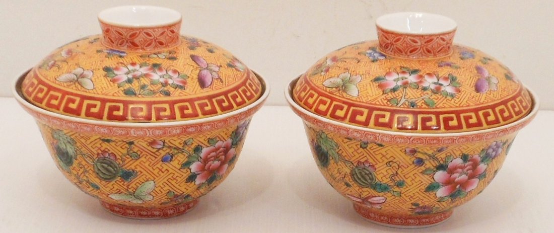 Pair of Famille Juane Porcelain Cups: China, 2 1/16" tall X 4 1/8" diameter, matching porcelain lidded cups, decorated with flowers, butterflies, fruit, banded and patterned designs on a yellow ground, marked, lid is also marked,
