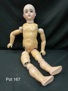 Antique German Kestner Bisque Head Doll With Composition Body 26": An antique German Kestner 26" bisque head doll with jointed composition body. This doll has painted facial features with blue glass eyes, closed mouth. It is marked "16" on the neck. *notes- needs res