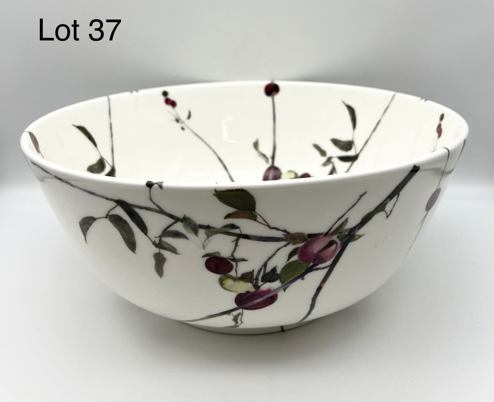 Signed Andrew Wyeth Royal Doulton Cherry Center Bowl: 1973 Royal Doulton bone china center bowl for The Franklin Mint with "Apple Branches" pattern signed by Pennsylvania artist, Andrew Wyeth (1917-2009) on the underside. This bowl measures 12 3/4" W x 5